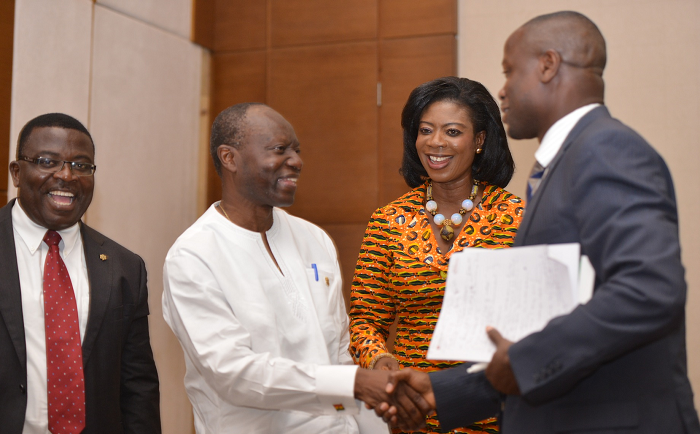  Mr Ken Ofori-Atta interacting with Dr Asibey Yeboah (right), Senior Lecturer of the University of Ghana, Mrs Kate Quartey-Papafio, Chairperson of Reroy Group of Companies, and Mr George Kwatia (left),Tax Lead, PWC,  after the forum. Picture: EMMANUEL QUAYE 
